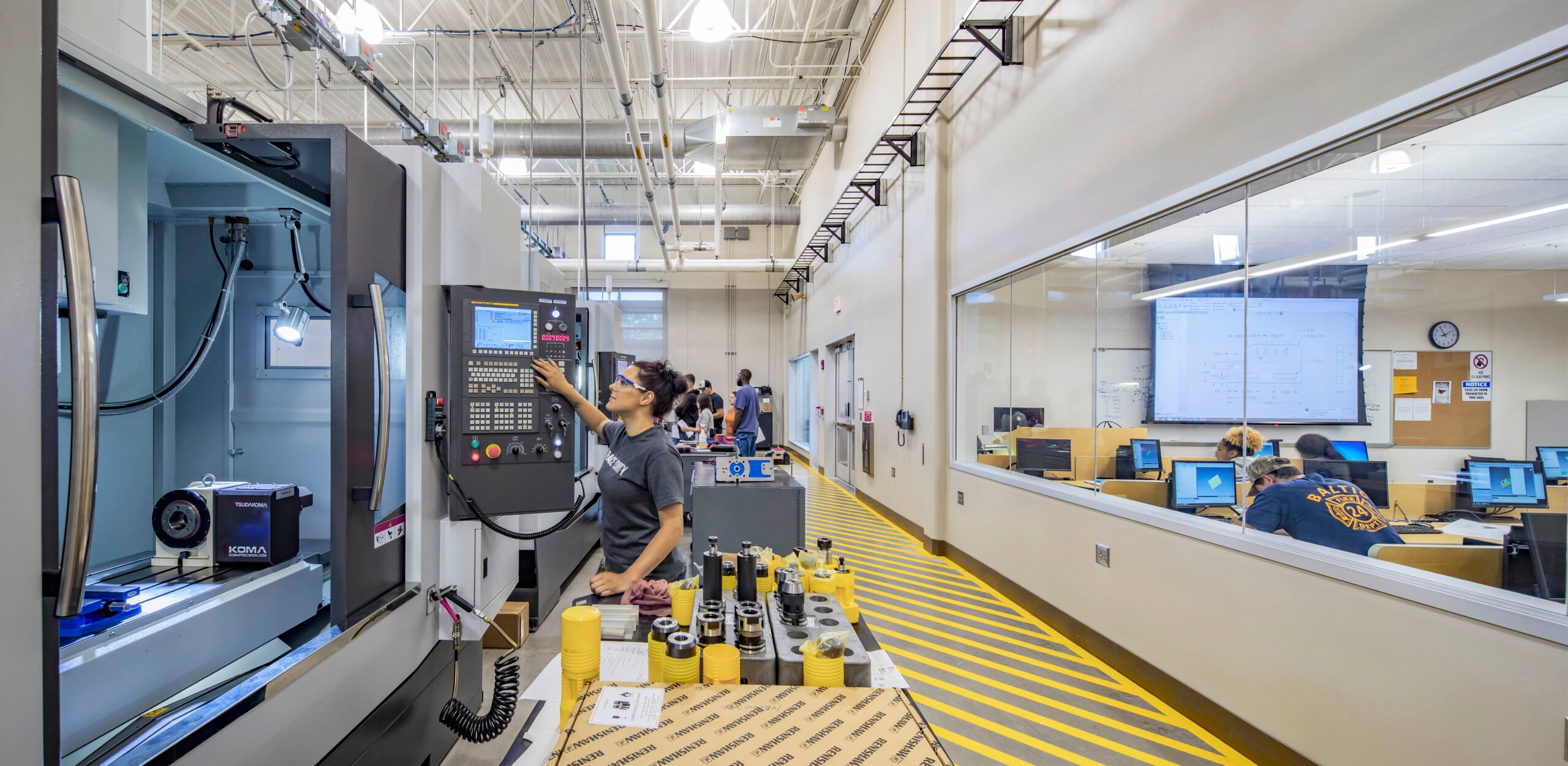 CT State Asnuntuck - Student Working on CNC Machine on Manufacturing Floor