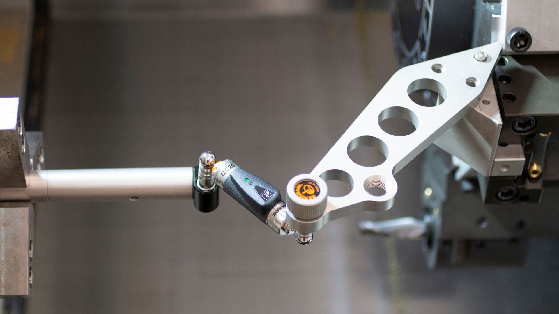 Ballbar testing setup measuring circularity and machine accuracy on a CNC system, representing diagnostic services used to identify performance gaps during preventative maintenance.