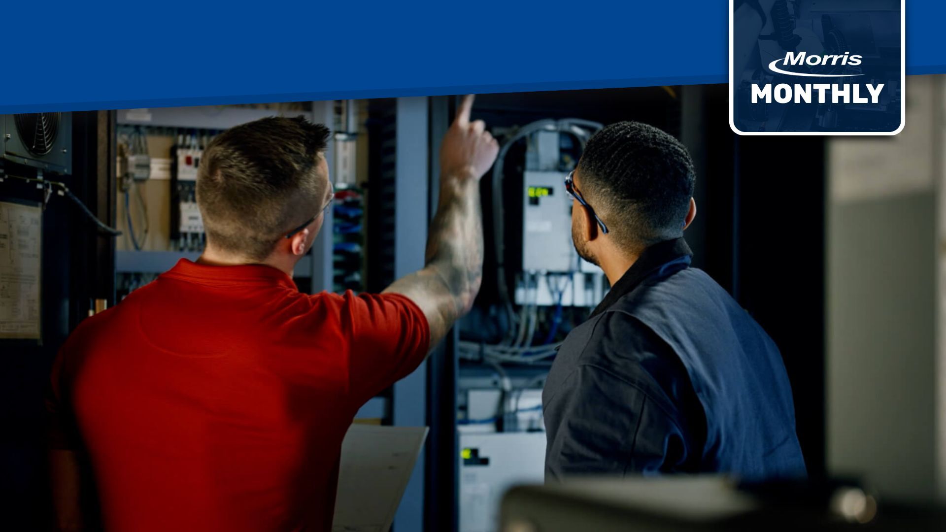 Featured image showing two technicians inspecting industrial electrical equipment, representing preventative maintenance programs that reduce downtime and support reliable manufacturing operations.